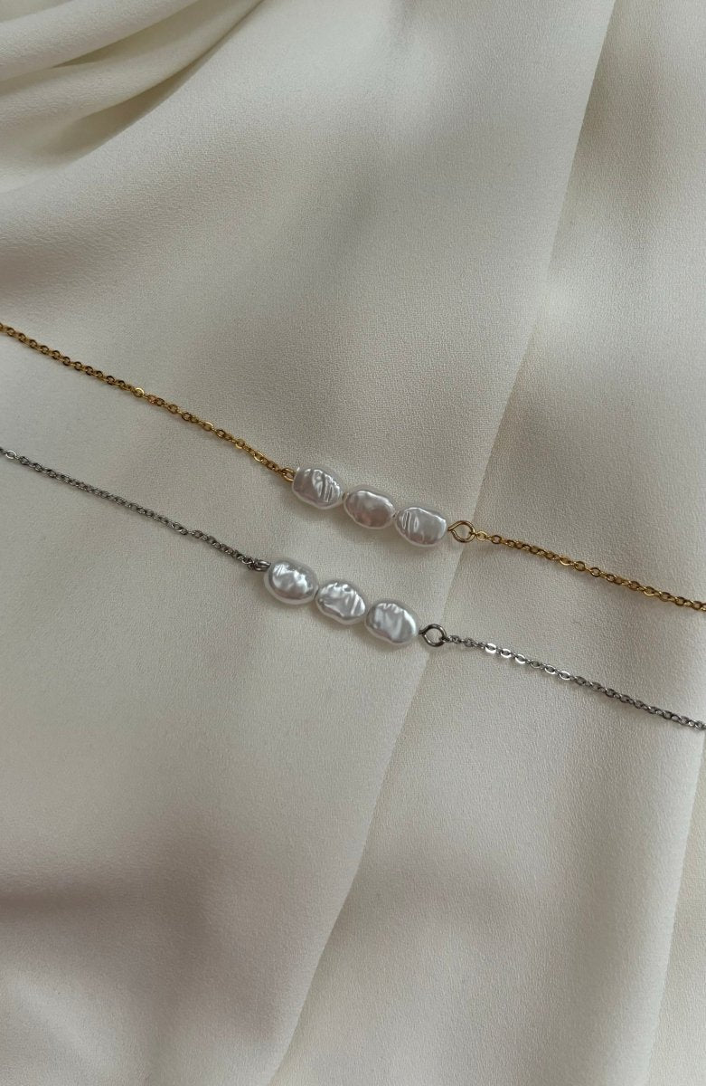 Trendy Pearl Drop armband van stainless steel – verkrijgbaar in goud en zilver, versierd met parels, elegant en duurzaam